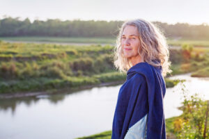 woman standing by a river